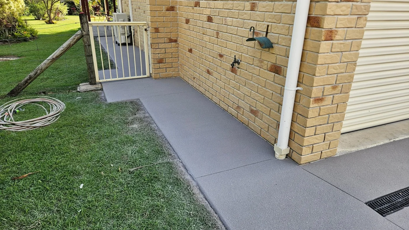 After: renewed side path against the brickwork