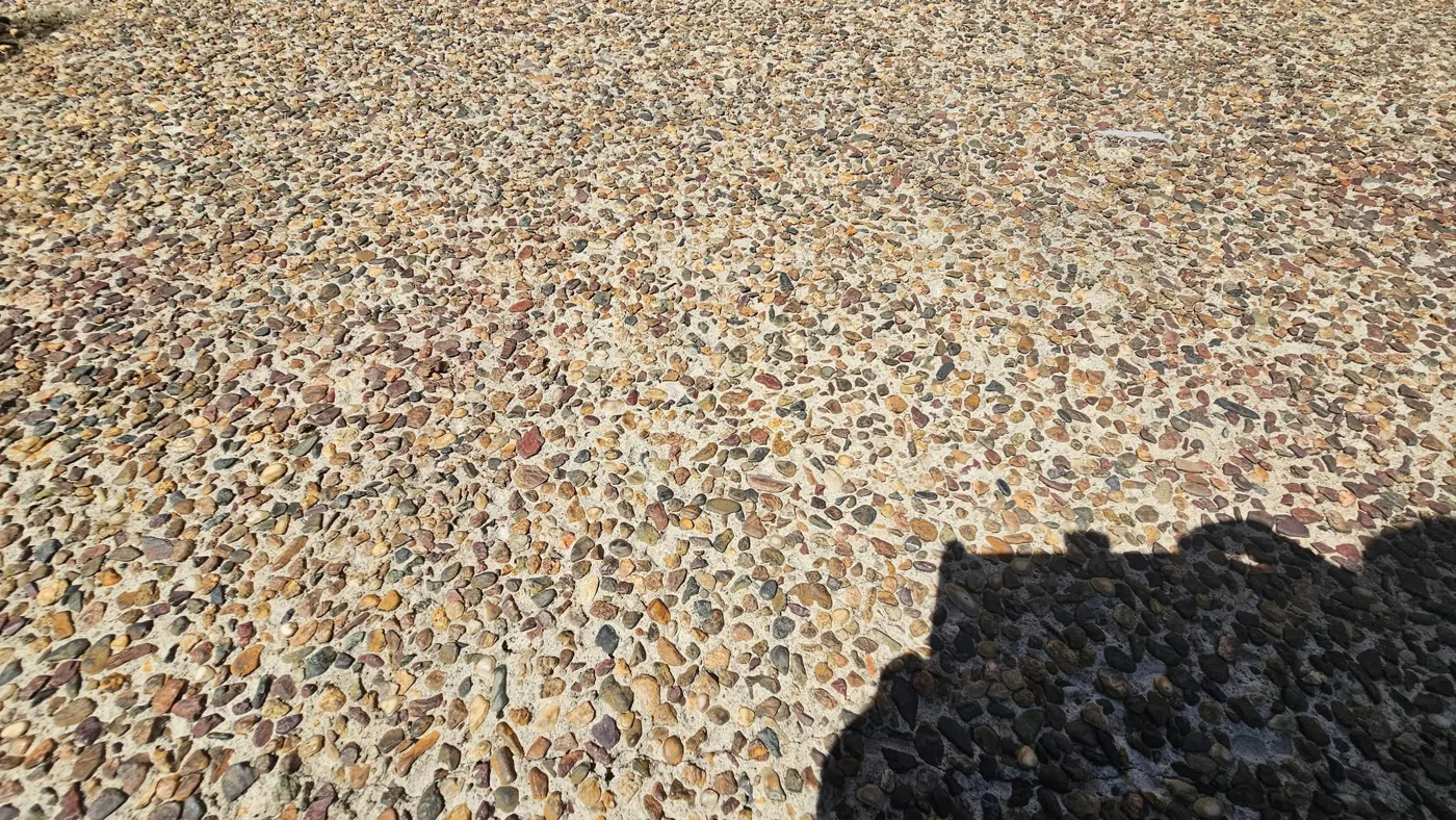 Before: close-up of the older exposed-aggregate surface