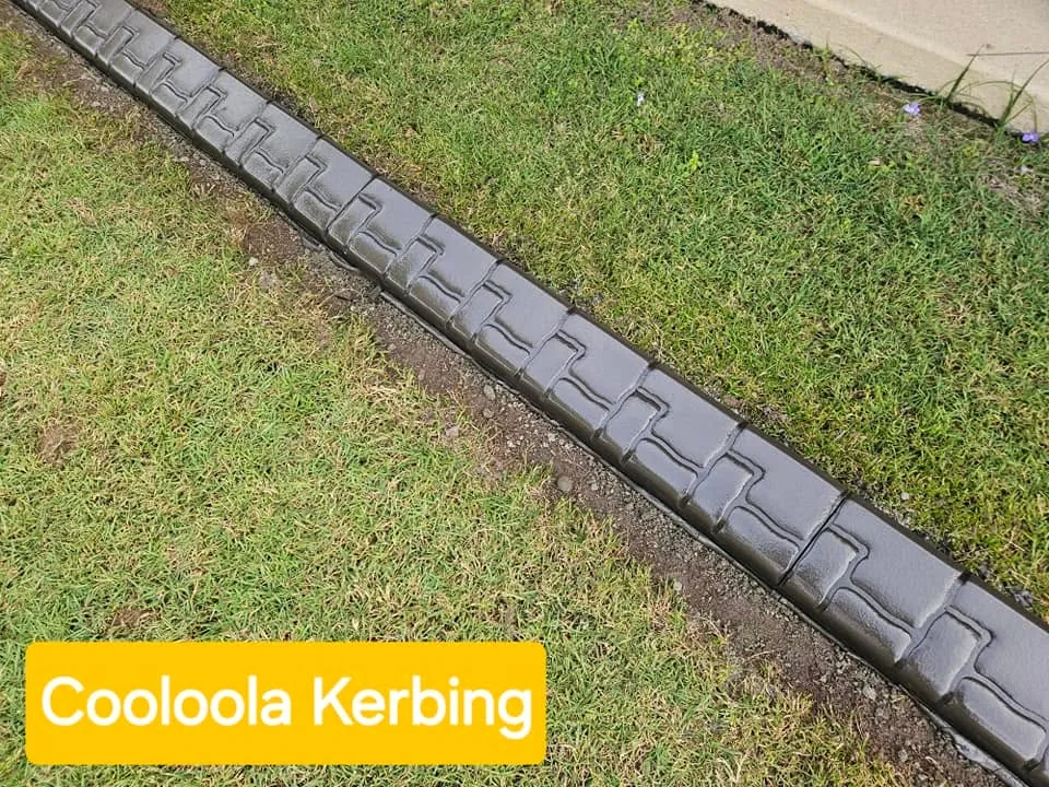 Stamped concrete garden edging following a curved lawn border