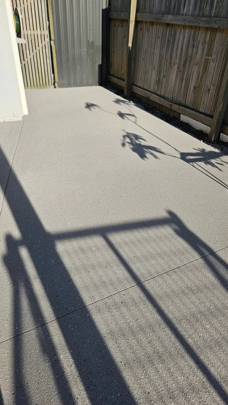 After: textured finish beside the home